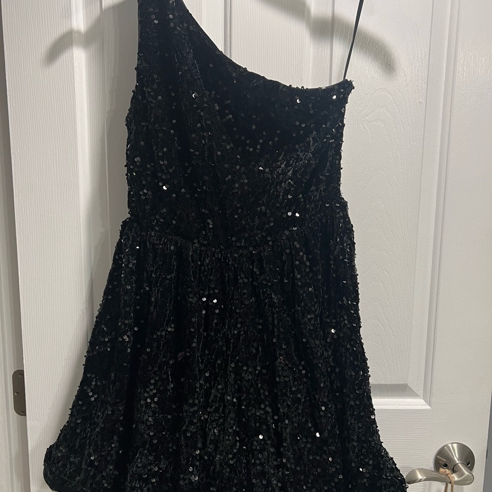 Beautiful, one shoulder sequin black dress. New without tags